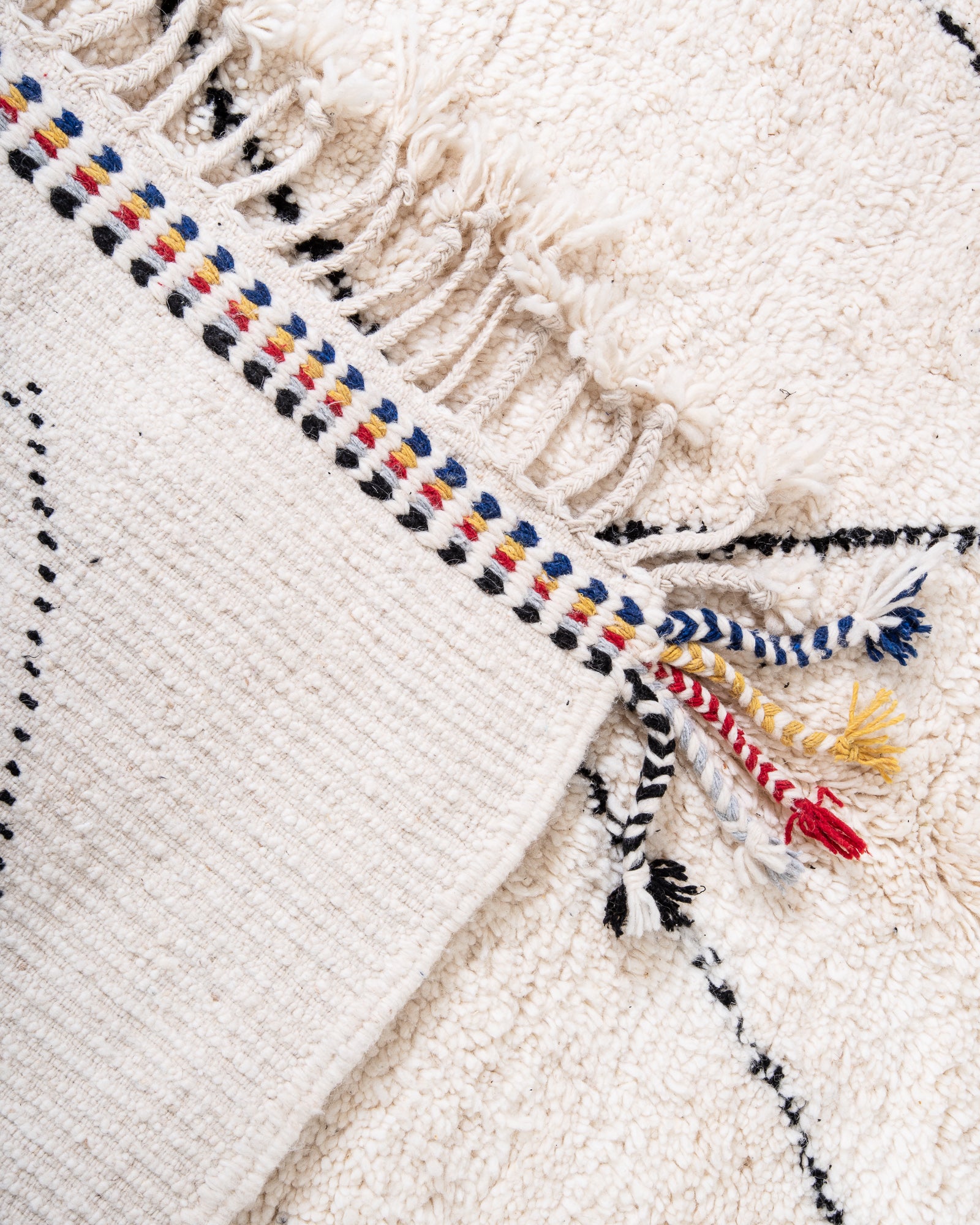 Modern, designer, handcrafted Berber rug from Morocco. Beniourain carpet with beautiful colours and patterns and fluffy wool texture.